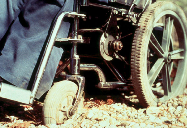 wheelchair on gravel surface