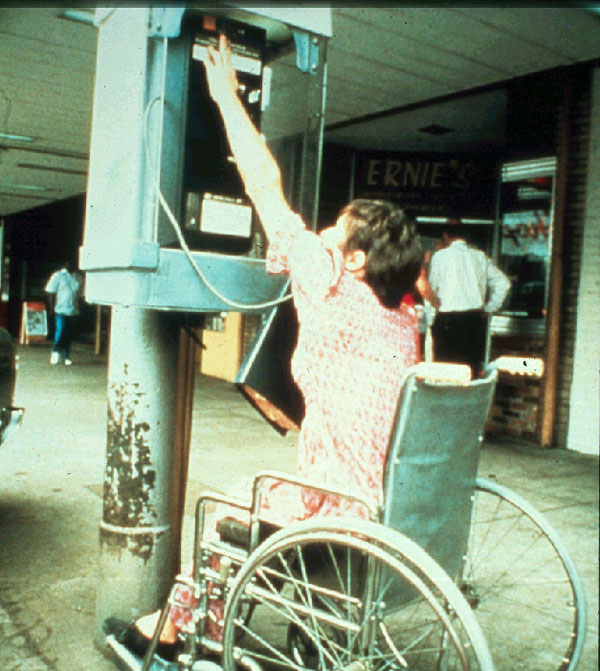 wheelchair user at pay phone